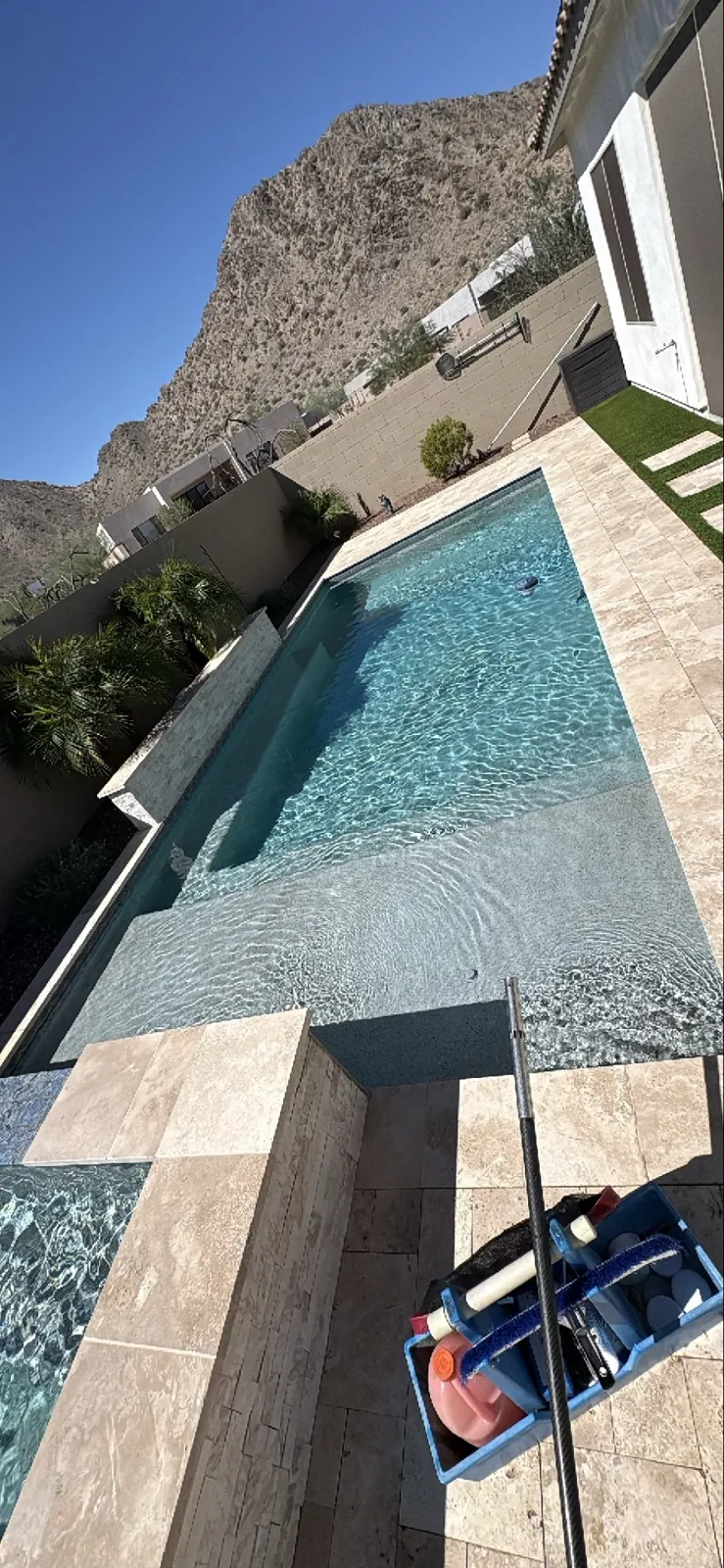 Clear blue pool water and service equipment at a Queen Creek, Arizona home