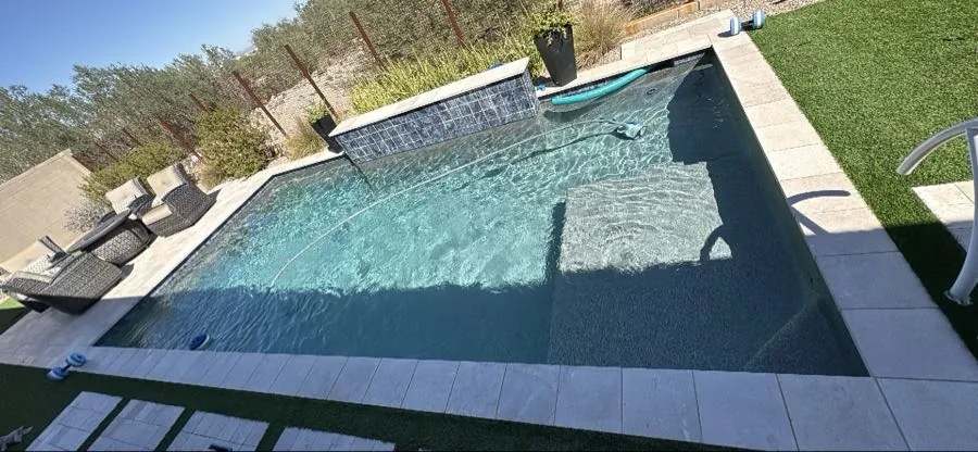 Aerial view of a sheeting waterfall wall feature on a pool in Queen Creek, Arizona