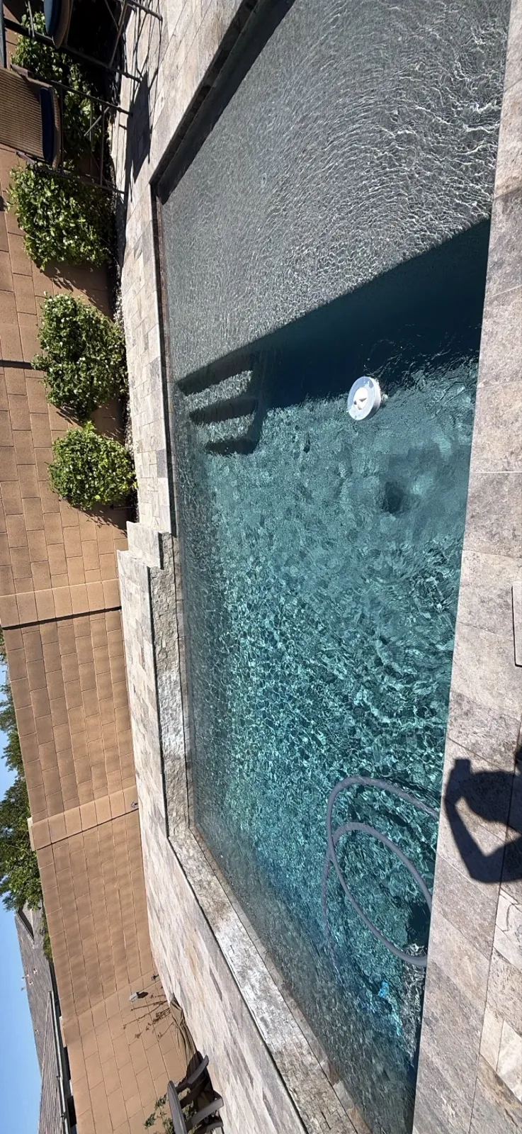 Aerial view of a clear rectangular pool in San Tan Valley during weekly cleaning service