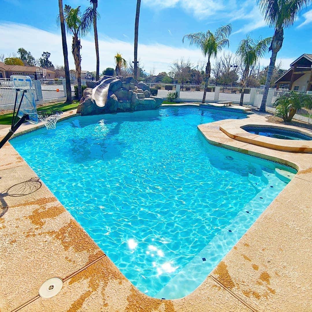 Clean, well-maintained swimming pool serviced by Tartan Pools in Gilbert, AZ