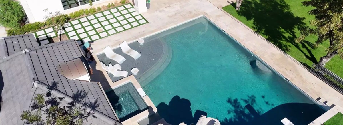 Tartan Pools professional pool service - aerial drone view of luxury pool maintenance in Gilbert Arizona