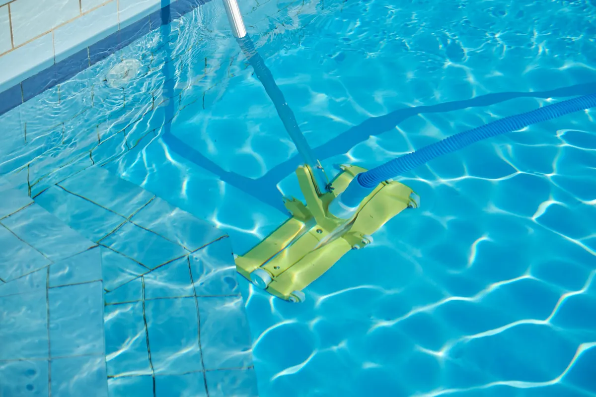 Skimming leaves and debris from a pool surface